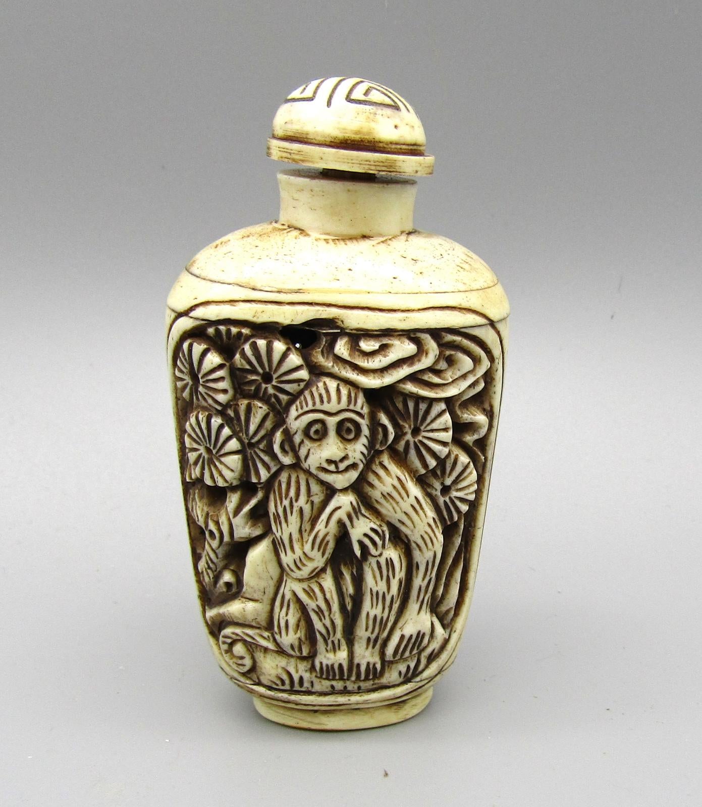 Vintage Chinese Carved Snuff Bottle with Monkey Motif